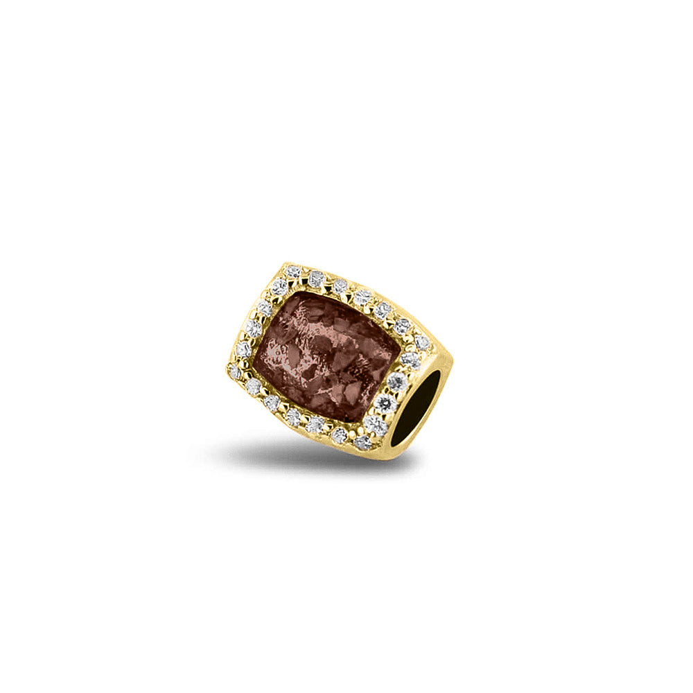 Asbedel rondom afgewerkt met zirkonia's die aan beide zijdes in twee compartimenten zichtbaar gevuld wordt met as of haar. Brown