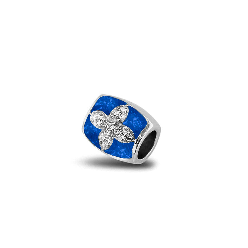 Asbedel met  zirkonia's, aan beide zijdes in twee compartimenten zichtbaar gevuld met as of haar. Blue