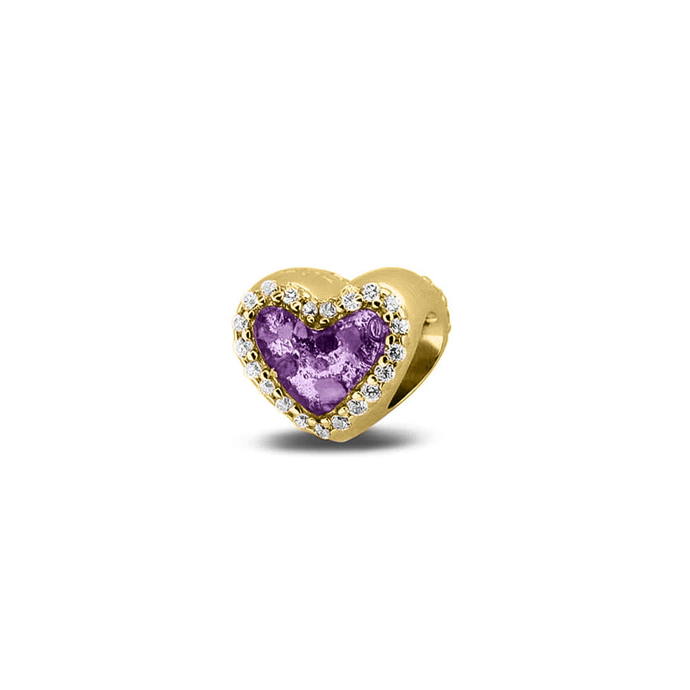 Hartvormige asbedel met  zirkonia's rondom afgewerkt, die aan beide zijdes in twee compartimenten zichtbaar gevuld wordt met as of haar met een keuze in 20 kleuren. Purple