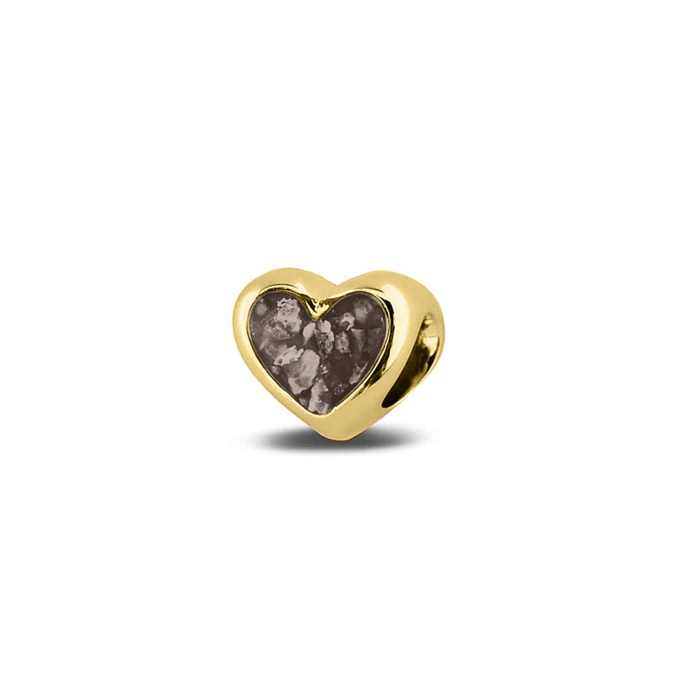 Hartvormige asbedel, aan beide zijdes zichtbaar gevuld met as of haar. Het vullen en sealen met onze speciale hars met een keuze in 20 kleuren, wordt in onze ambachtelijke edelsmederij gedaan. Silver