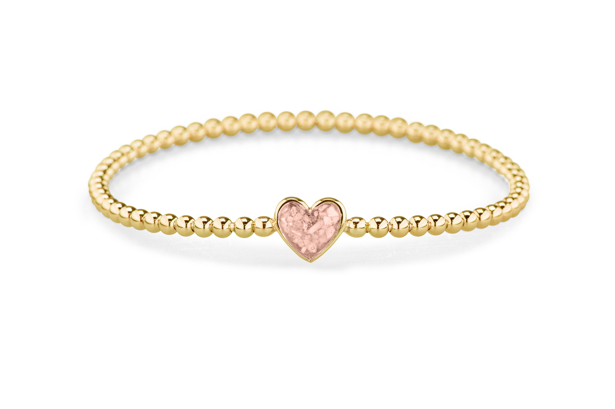 Flexibele as armband met hart als compartiment voor as of haar, gedenksieraden. Blush