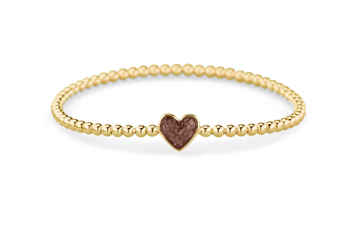 Flexibele as armband met hart als compartiment voor as of haar, gedenksieraden. Brown