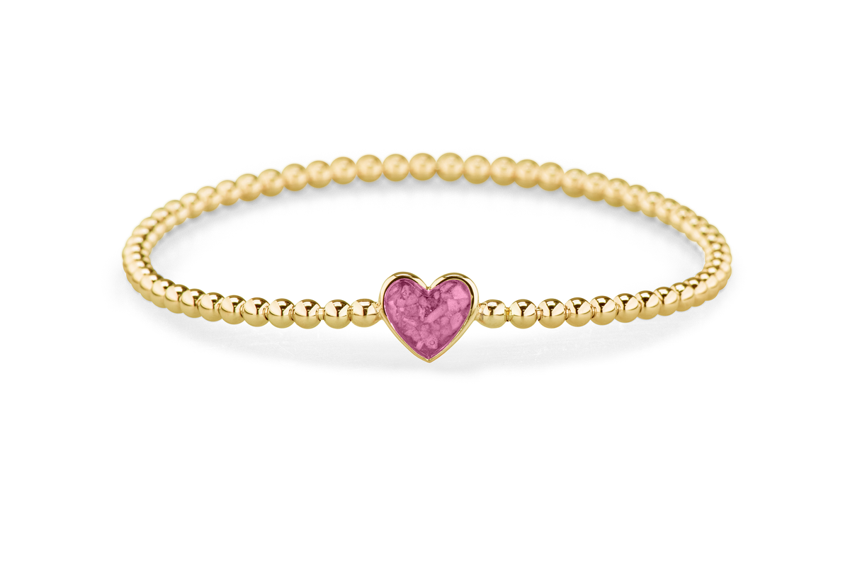 Flexibele as armband met hart als compartiment voor as of haar, gedenksieraden. Fluo