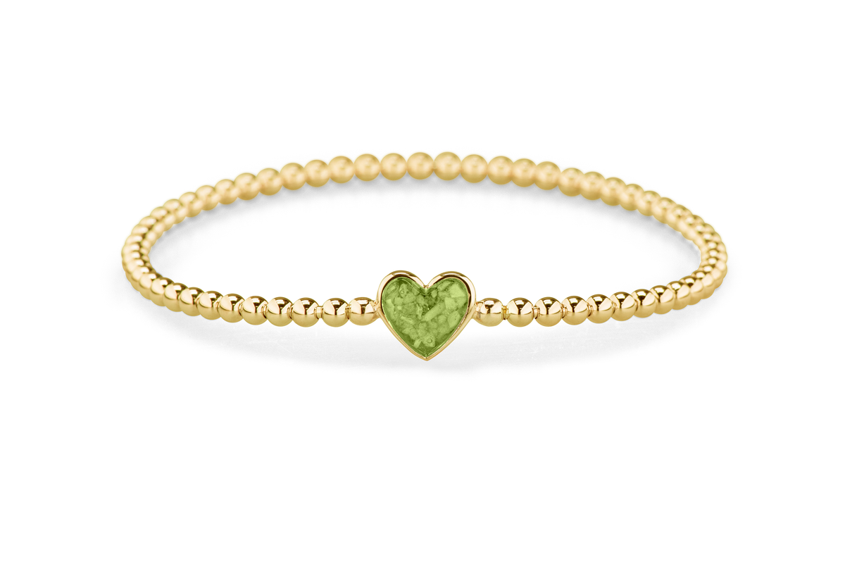 Flexibele as armband met hart als compartiment voor as of haar, gedenksieraden. Green