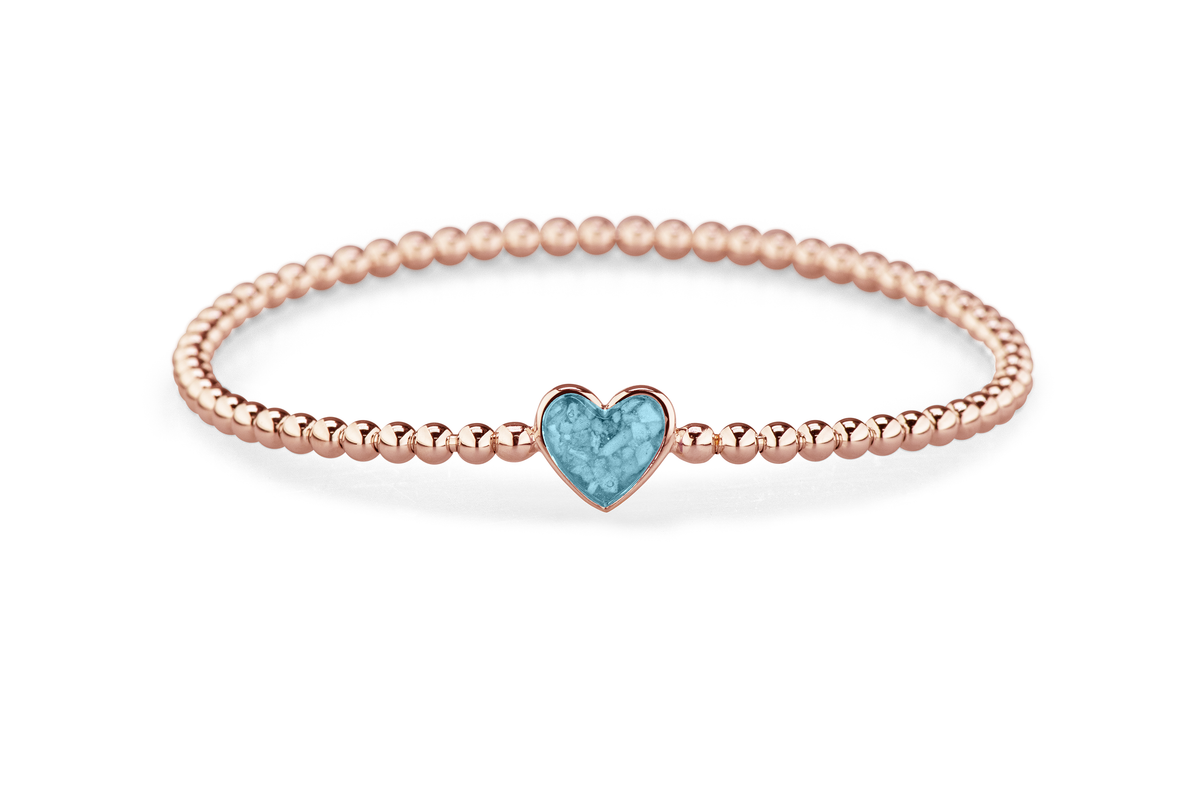 Flexibele as armband met hart als compartiment voor as of haar, gedenksieraden. Baby