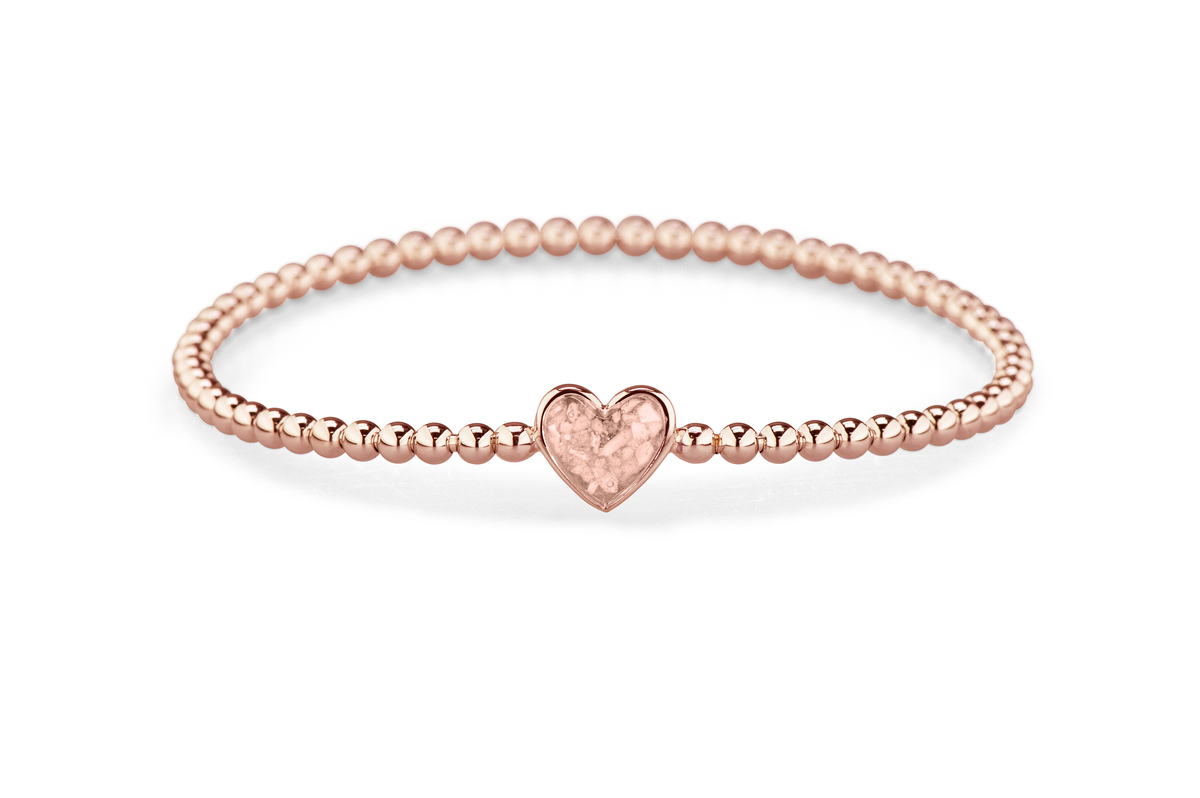 Flexibele as armband met hart als compartiment voor as of haar, gedenksieraden. Blush