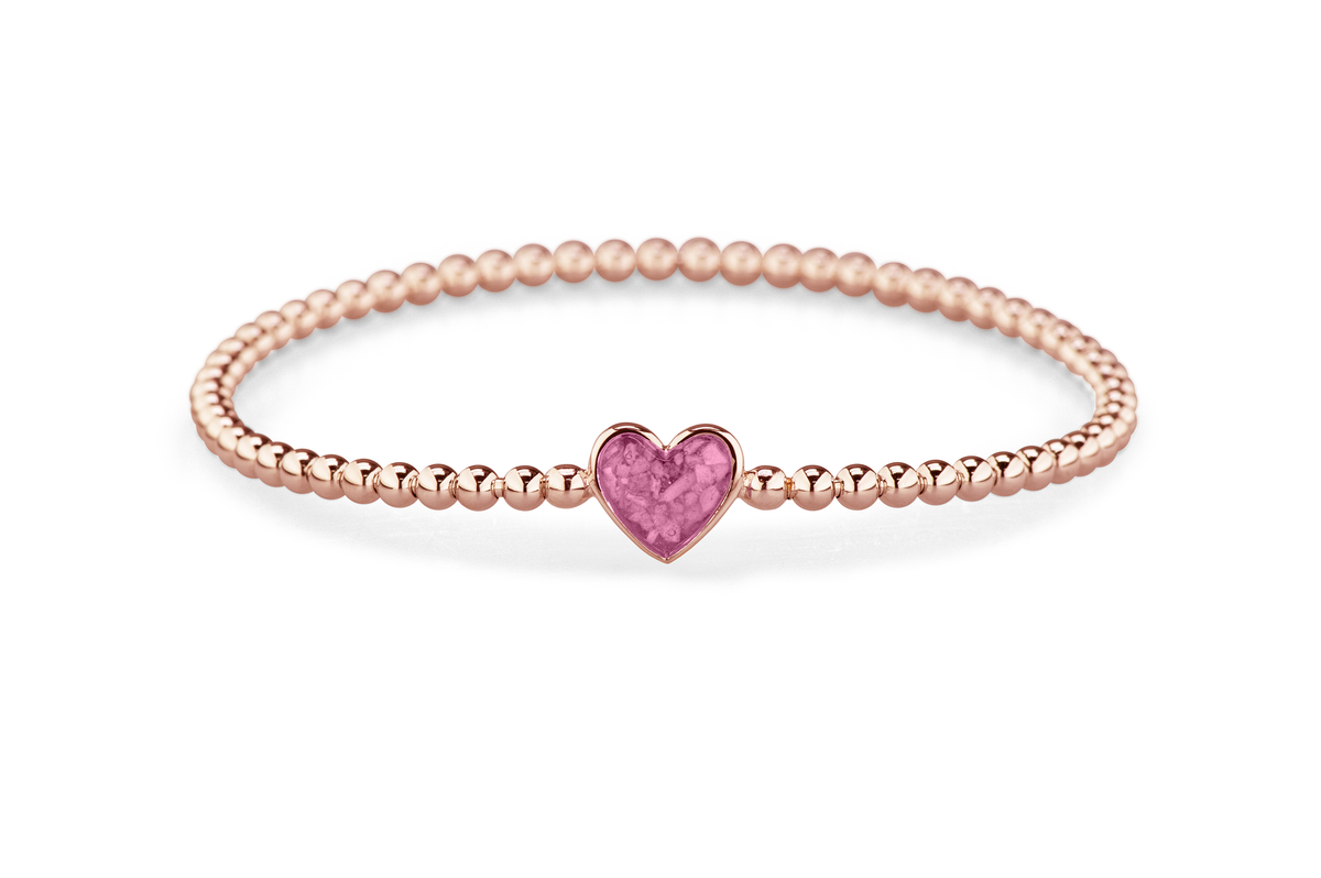 Flexibele as armband met hart als compartiment voor as of haar, gedenksieraden. Fluo