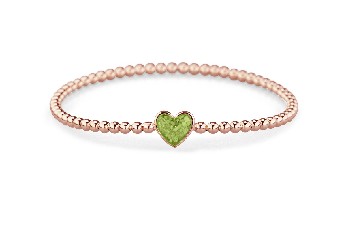 Flexibele as armband met hart als compartiment voor as of haar, gedenksieraden. Green