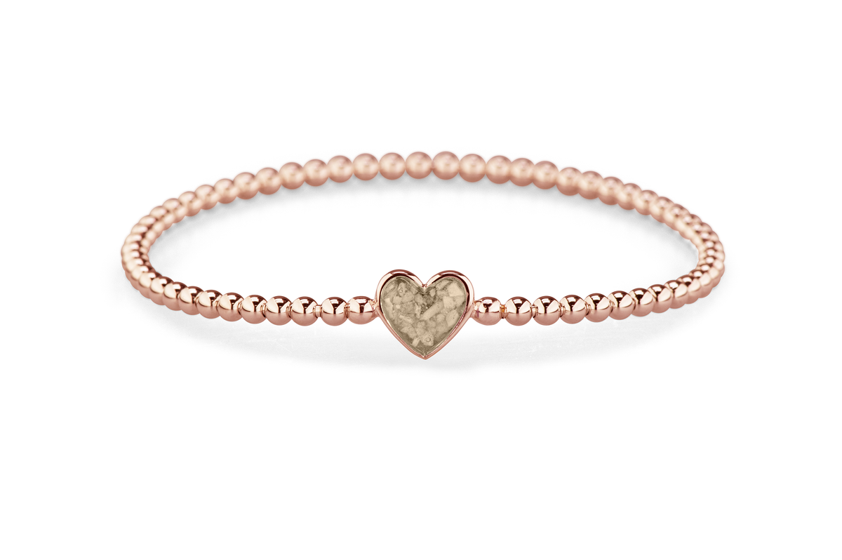 Flexibele as armband met hart als compartiment voor as of haar, gedenksieraden. Transparent