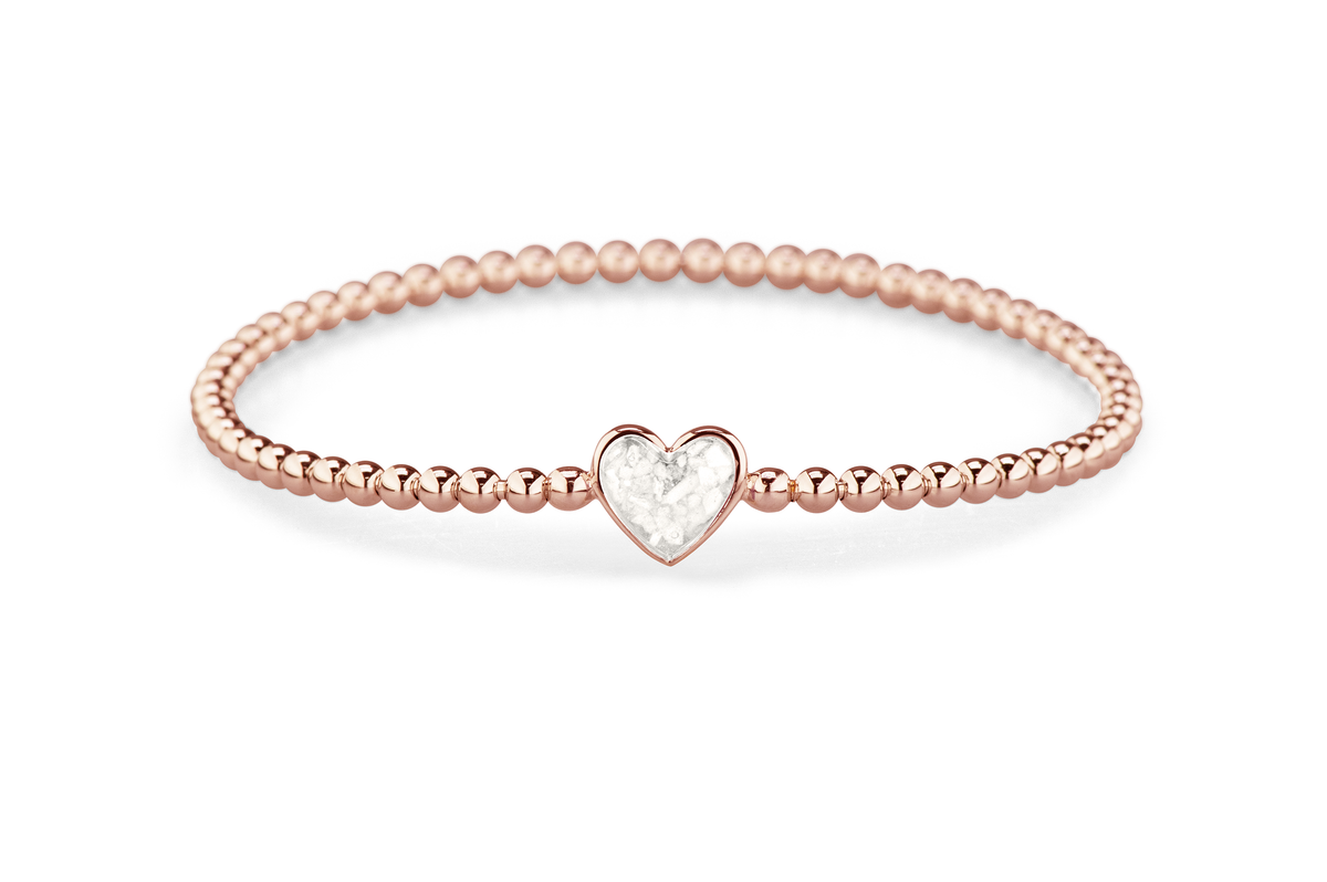 Flexibele as armband met hart als compartiment voor as of haar, gedenksieraden. White