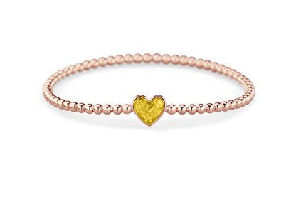 Flexibele as armband met hart als compartiment voor as of haar, gedenksieraden. Yellow