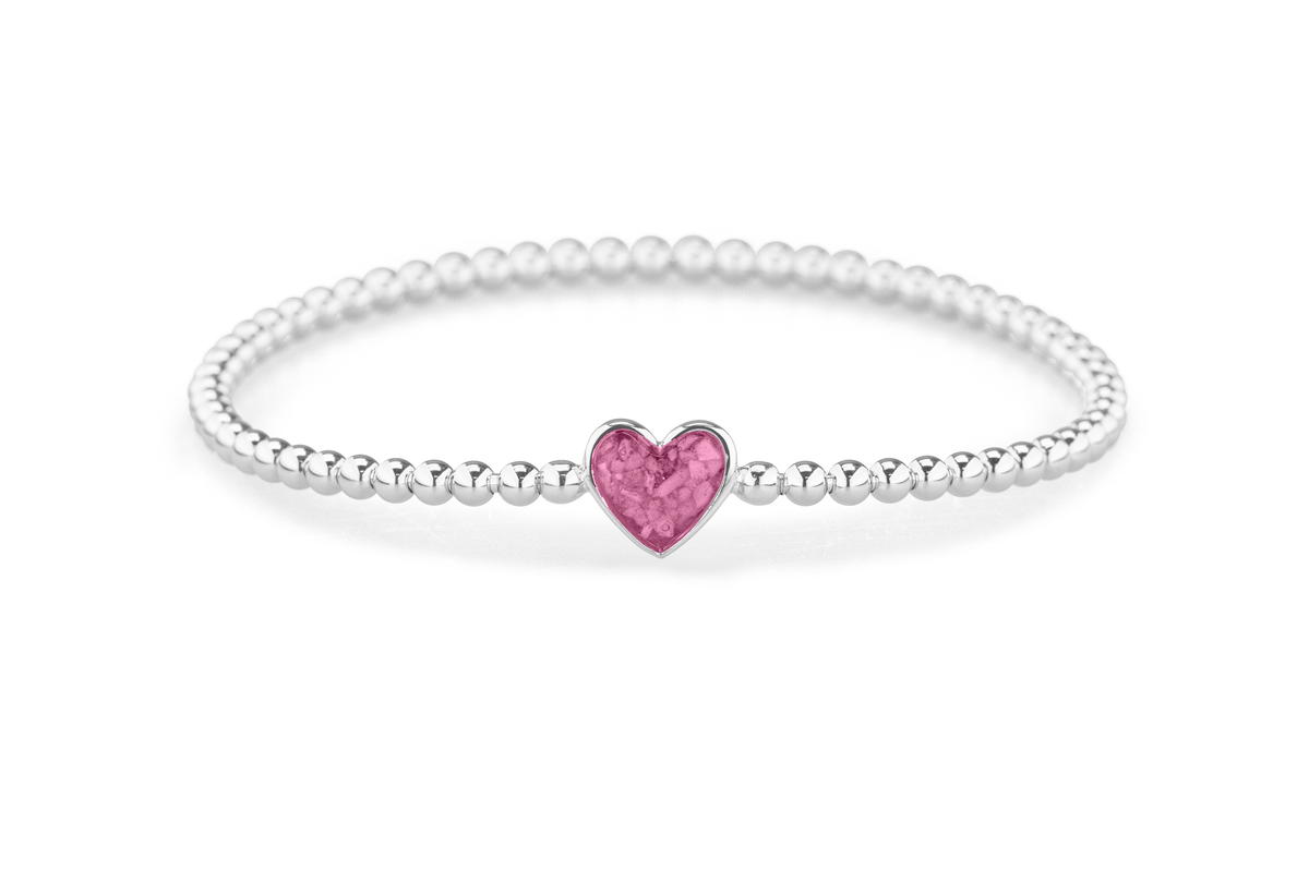 Flexibele as armband met hart als compartiment voor as of haar, gedenksieraden. Fluo