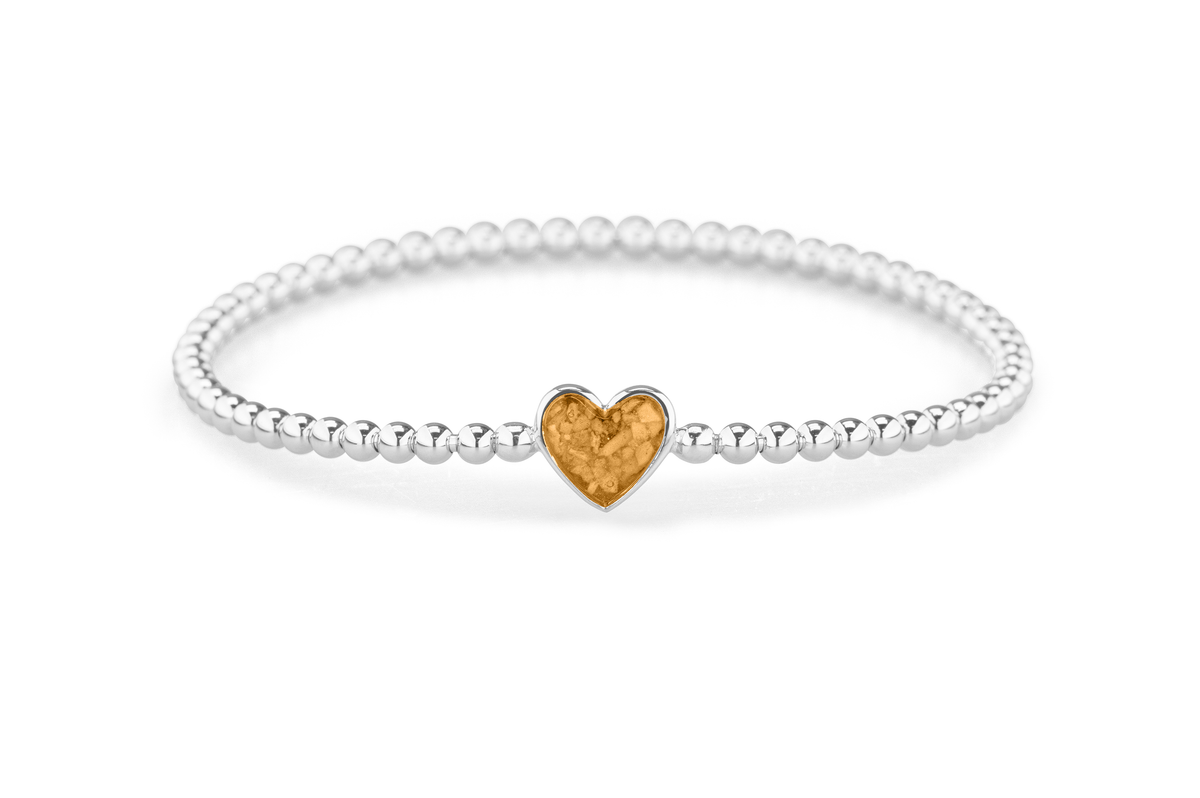 Flexibele as armband met hart als compartiment voor as of haar, gedenksieraden. Gold