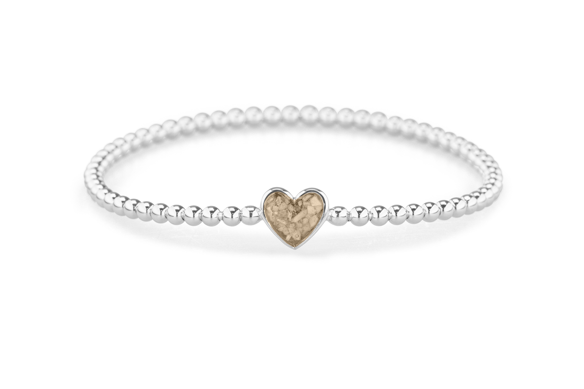 Flexibele as armband met hart als compartiment voor as of haar, gedenksieraden. Transparent