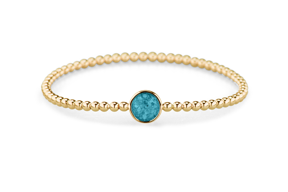 Flexibele as armband met rondje als compartiment voor as of haar, gedenksieraden. Turquoise