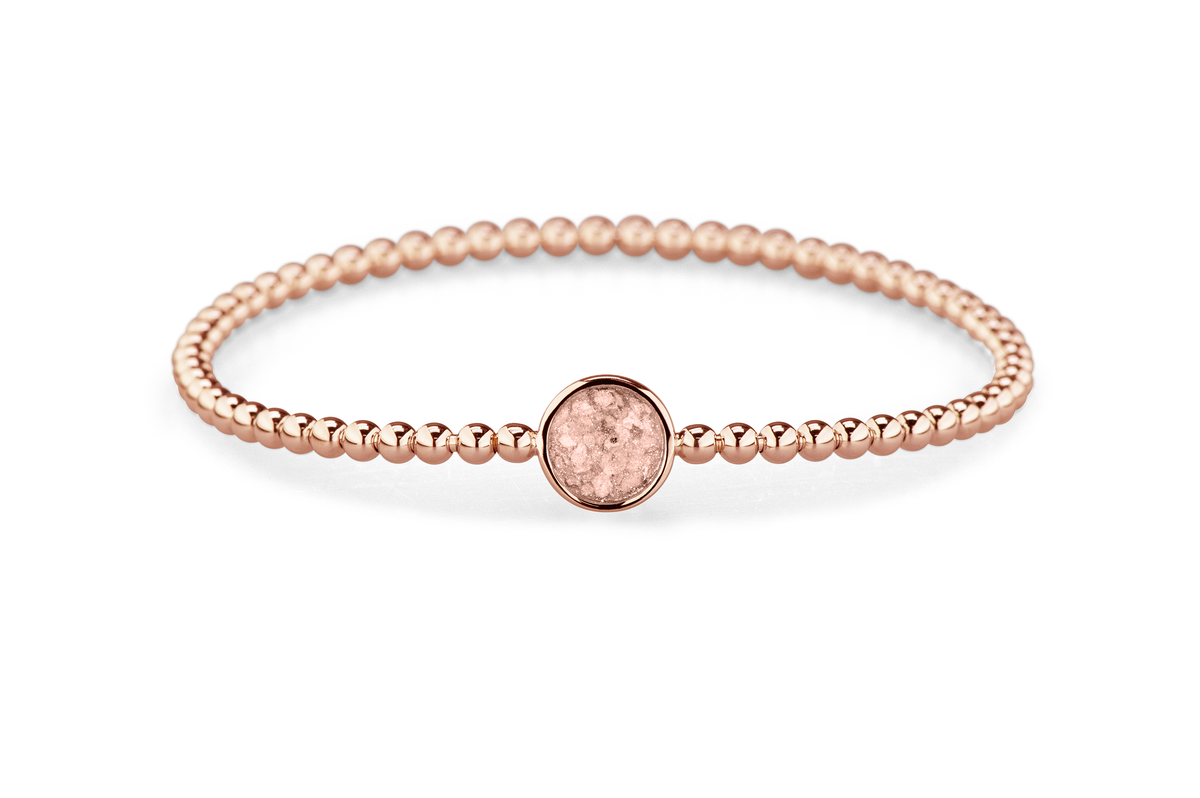 Flexibele as armband met rondje als compartiment voor as of haar, gedenksieraden. Blush