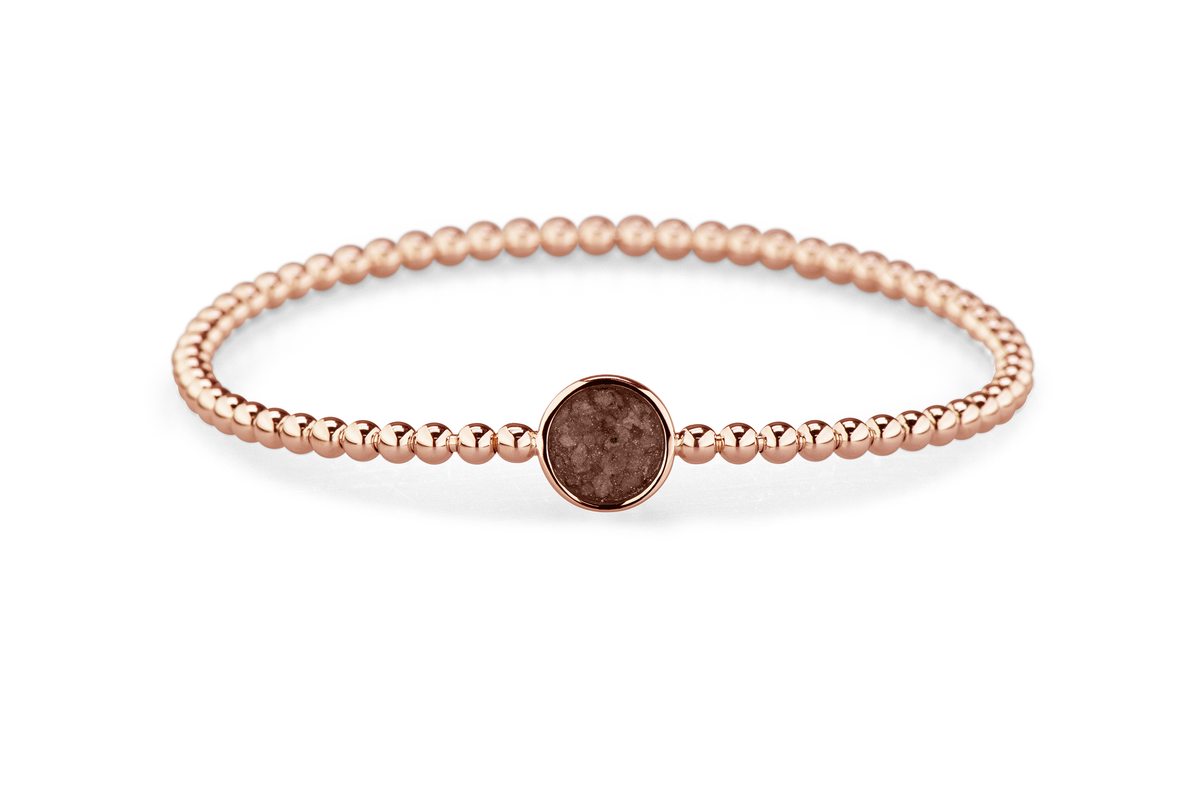 Flexibele as armband met rondje als compartiment voor as of haar, gedenksieraden. Brown