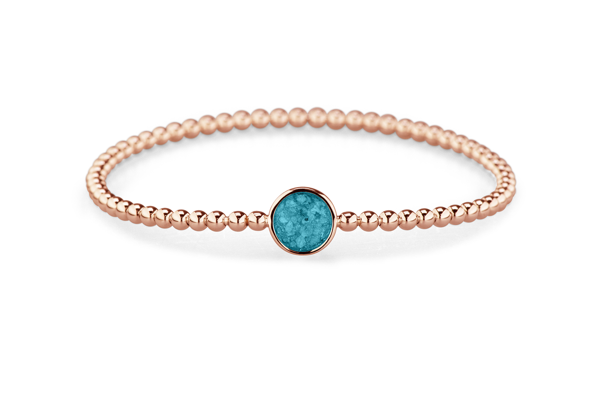 Flexibele as armband met rondje als compartiment voor as of haar, gedenksieraden. Turquoise