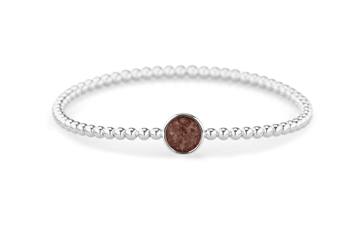 Flexibele as armband met rondje als compartiment voor as of haar, gedenksieraden. Brown