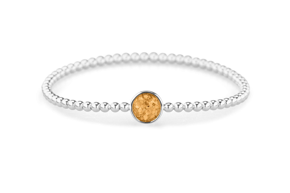 Flexibele as armband met rondje als compartiment voor as of haar, gedenksieraden. Gold