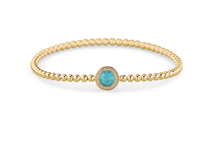 Flexibele as armband met rondje als compartiment gezet rondom met zirconia's voor as of haar. Aqua