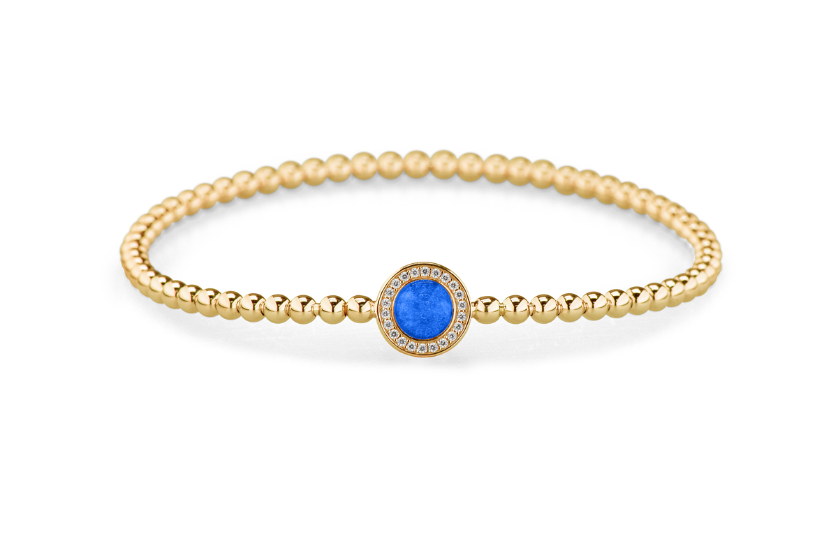 Flexibele as armband met rondje als compartiment gezet rondom met zirconia's voor as of haar. Blue
