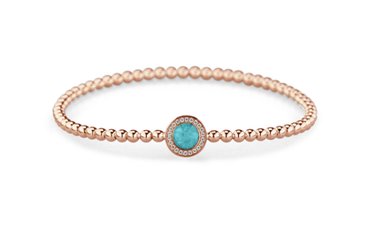 Flexibele as armband met rondje als compartiment gezet rondom met zirconia's voor as of haar. Aqua