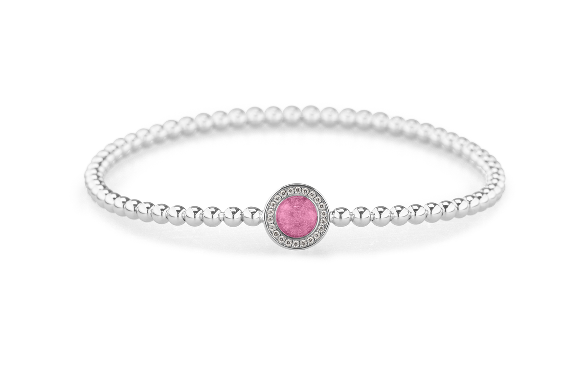 Flexibele as armband met rondje als compartiment gezet rondom met zirconia's voor as of haar. Fluo