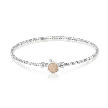 Zilveren as armband met in het midden een ornamentje, gedenksieraad. Transparent