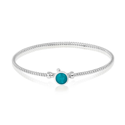 Zilveren as armband met in het midden een ornamentje, gedenksieraad. Turquoise
