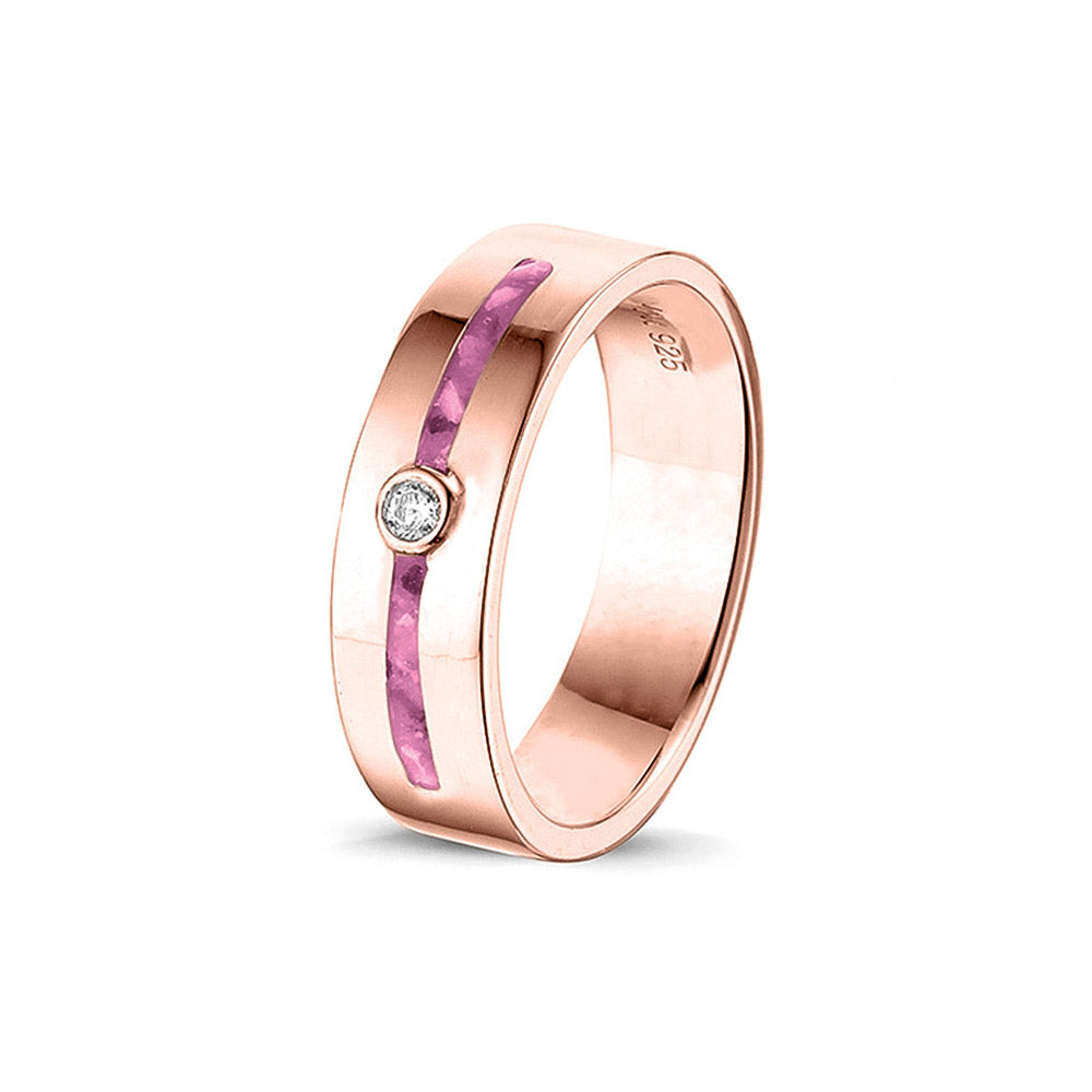 Asring 5 mm uit onze serie gedenksieraden, waar zichtbaar as of haar verwerkt wordt in twee separate compartimenten met in het midden een zirkonia of diamant naar keuze. Fluo