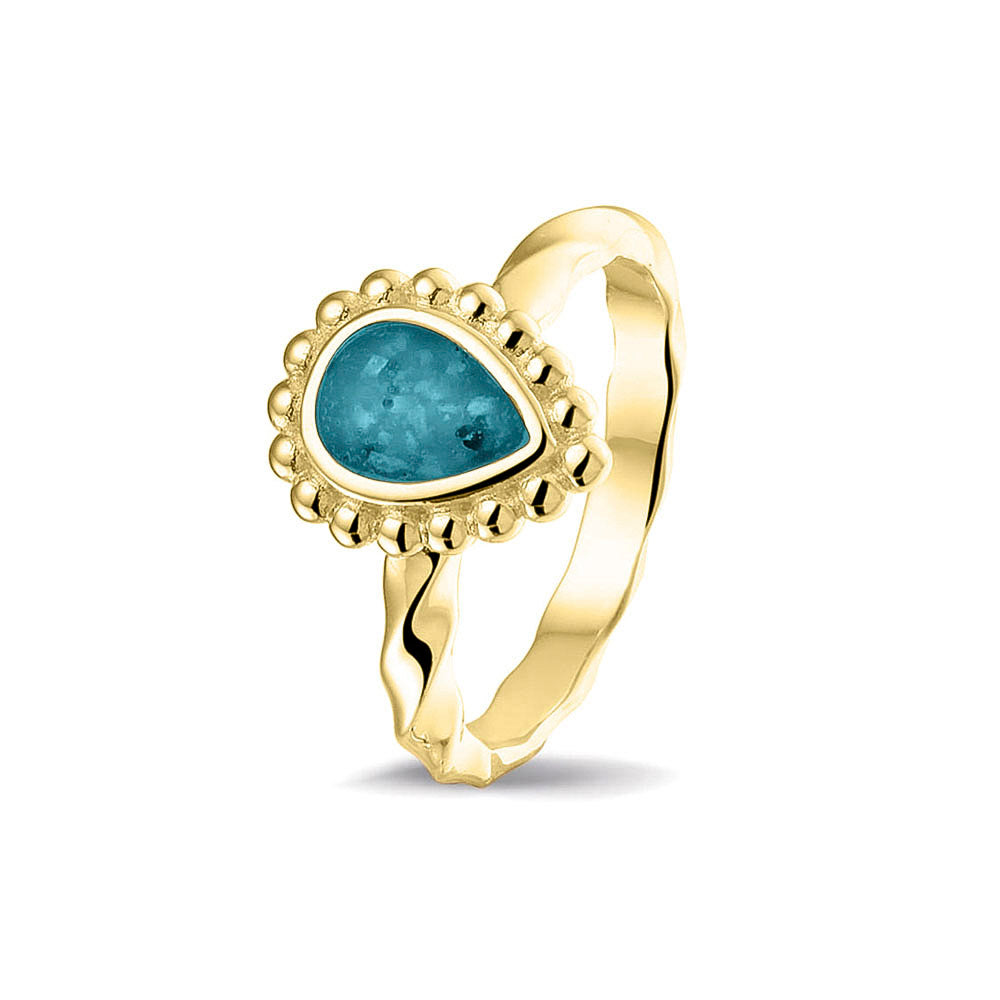 Gedenksieraad, asring met gedraaide scheen waar aan de bovenzijde in druppelvorm met parelrand zichtbaar as of haar (of eventueel melktandjes of moedermelk) verwerkt wordt.turquoise