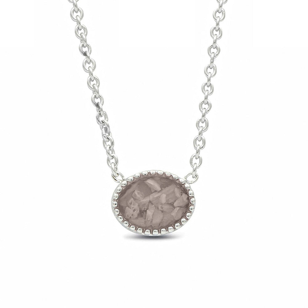 Ashanger, gedenksieraad, waar as en haar in verwerkt wordt. Silver