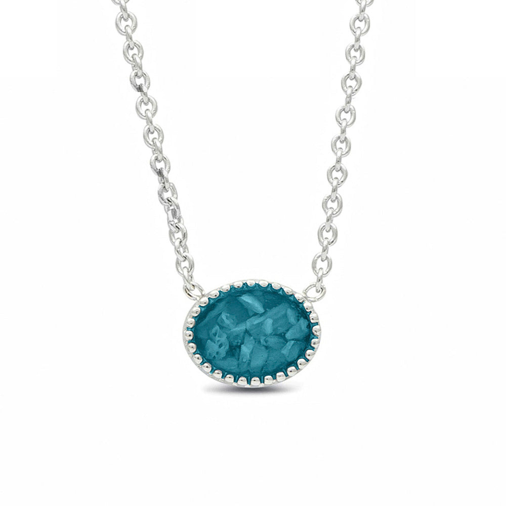 Ashanger, gedenksieraad, waar as en haar in verwerkt wordt. turquoise