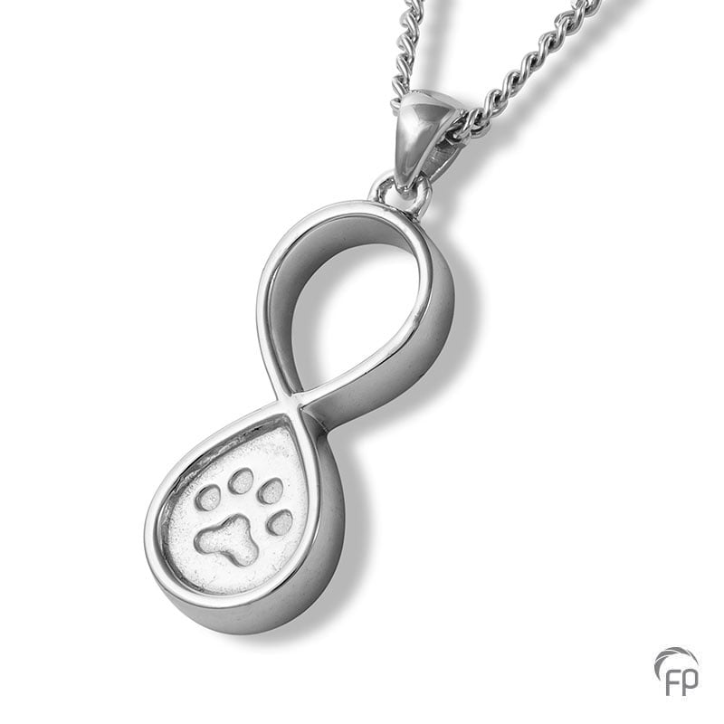 Deze zilveren 925 sterling ashanger infinity met pootafdrukje kenmerkt zich door het fraai en speels ontworpen karakter. Dit gedenksieraad kan met as en ook met haar van je huisdier gevuld worden.